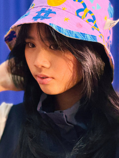 Reversible Bucket Hat in Confetti and Party Poppers